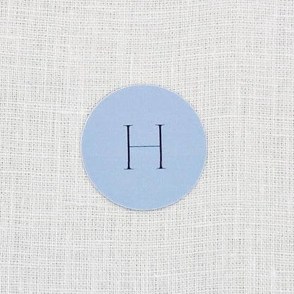 dusty blue wedding favor sticker with initial