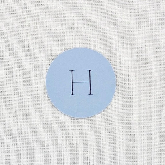 dusty blue wedding favor sticker with initial